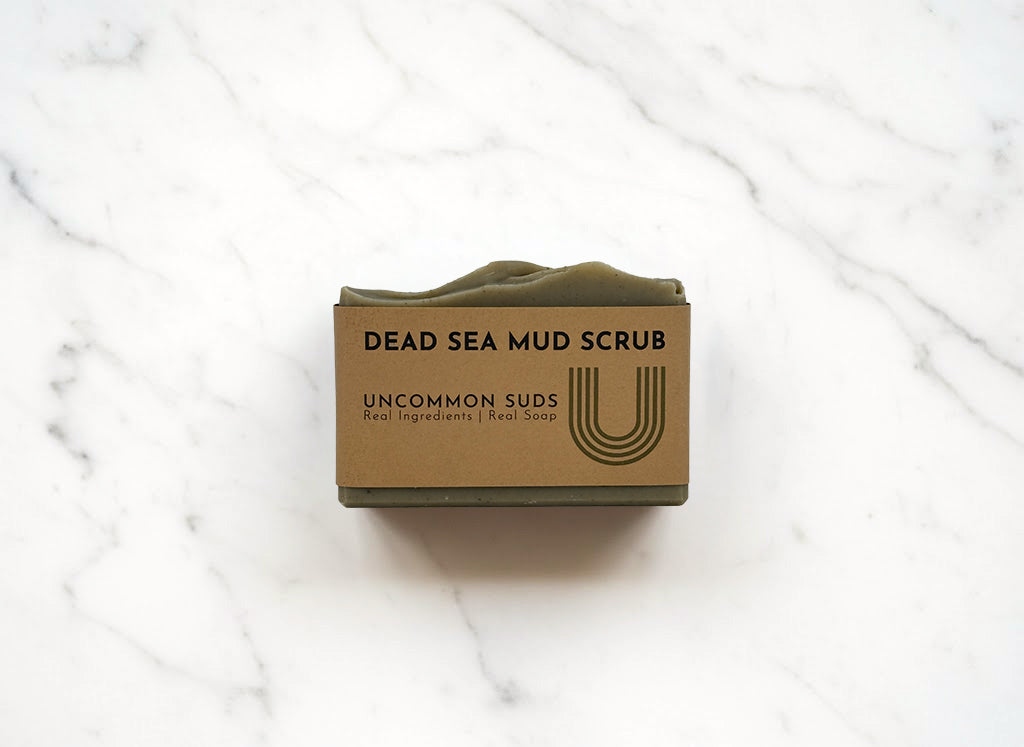 Front of Dead Sea Mud Scrub Soap Bar with Uncommon Suds Label 
